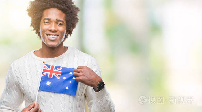 美国黑人国旗在澳大利亚的与世隔绝的背景下,脸上挂着