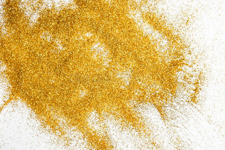 金色闪光的沙子纹理在白色，抽象的背景。