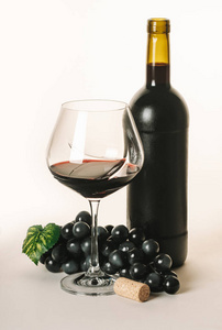 bottle and glass with red wine 