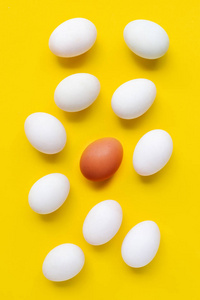 Fresh eggs on yellow background. 