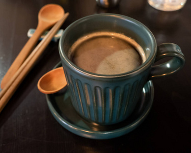 Coffee cup on  brown wooden table 