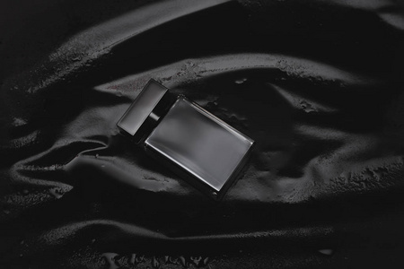 black perfume on dark background 