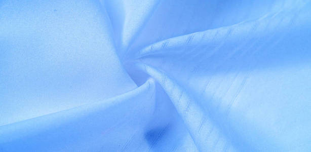 纹理背景，图案。蓝色丝绸面料。从Telio，这个