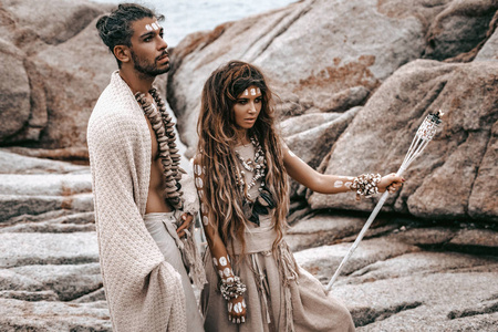 beautiful young wild free couple in tribal costumes 