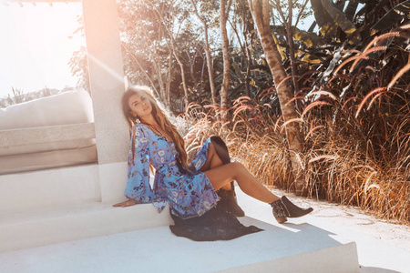 beautiful young fashion model in elegant dress at sunset 