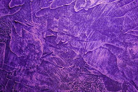 一个美丽的混凝土蓝紫色背景，有许多斑点和大脑的划痕。