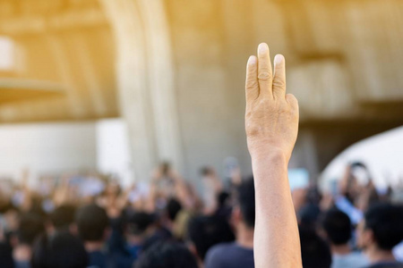 Elderly women tree fingers sign for freedom 