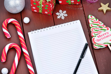 Empty notebook with christmas ornament on table