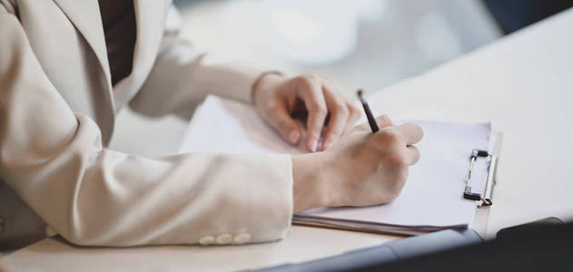 Cropped shot of professional businesswoman working on her projec