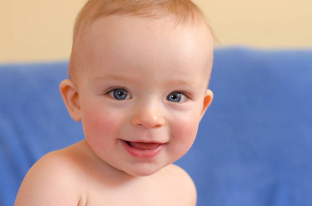 Closeup portrait of beautiful smiling baby. 