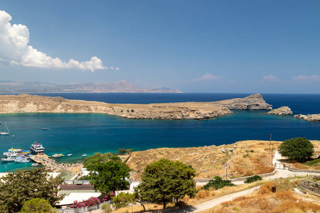 Scenic view from the acropolis on a bay with blue and turquoise 