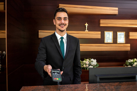 Credit card reader at a hotel reception desk 