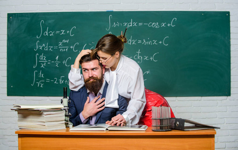 Emancipation. Couple in love in school. Sensual couple in class.