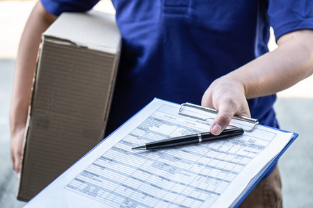 Delivery man deliver box parcel package and clipboard documents 