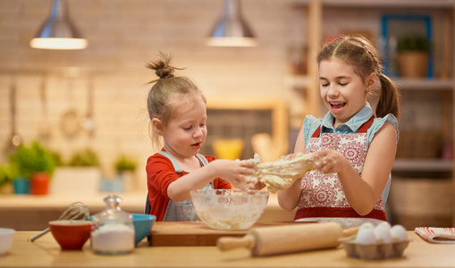 girls are cooking cookies 