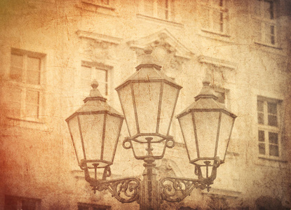 aged street lighting lamp in Germany. Image in old color style 