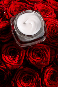 Moisturizing beauty face cream for sensitive skin and red roses 