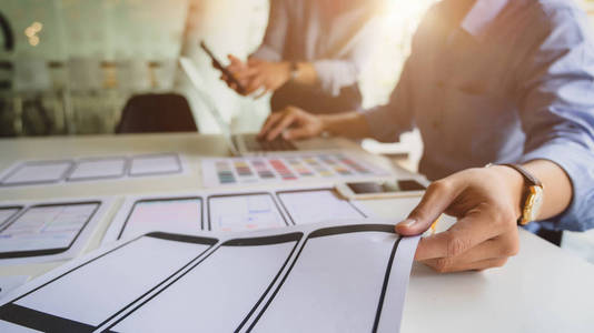 Cropped shot of UI designer picking up the idea for his smartpho