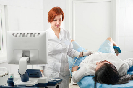 Gynecologist doing ultrasound scanning 