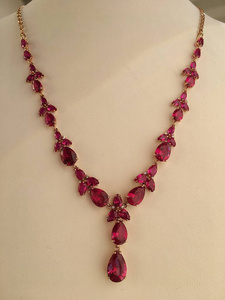  Gold ruby necklace on a jewelry stand. luxury jewelry.