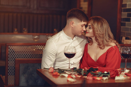 Elegant couple spend time in a restaurant