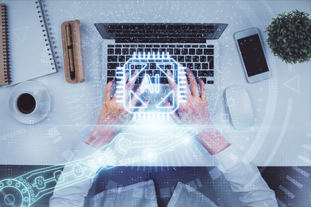 电脑和数据主题全息图绘制中女性双手的双重曝光。俯视图。技术概念。