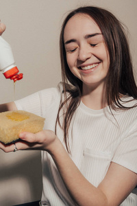 girl pours dishwashing liquid 