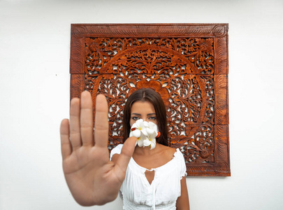  Girl in an antiviral mask on an unusual background. Fashion pho