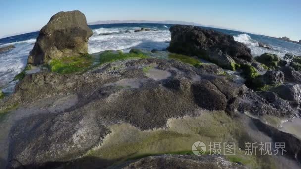 beautiful resort beach with stone in Rhodes. Aegean seashore  4K