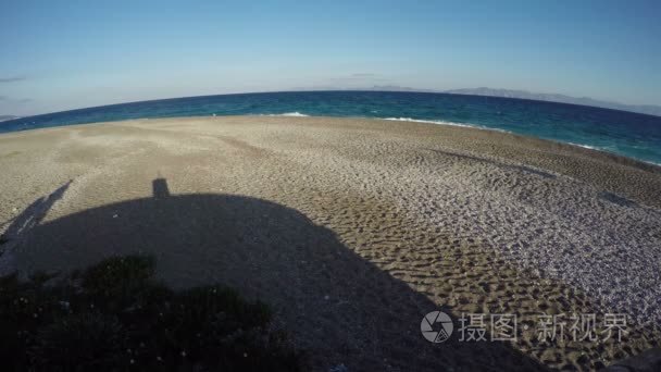 Aegean sea  beach in morning and shadows. 4K