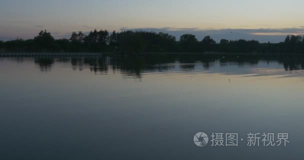 Rippling Water Closeup  Horizon Trees` Silhouettes Blue Sky  Hor