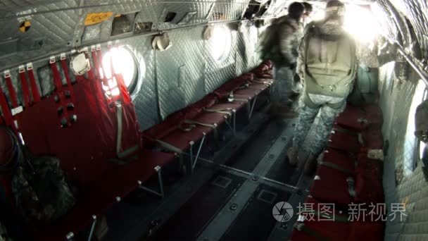 Paratroopers jumping out the back of a CH-47 Chinook helicopter