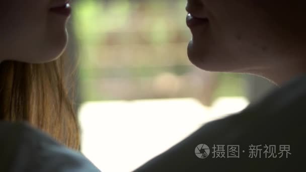 情侣接吻紧靠窗口背景短视频