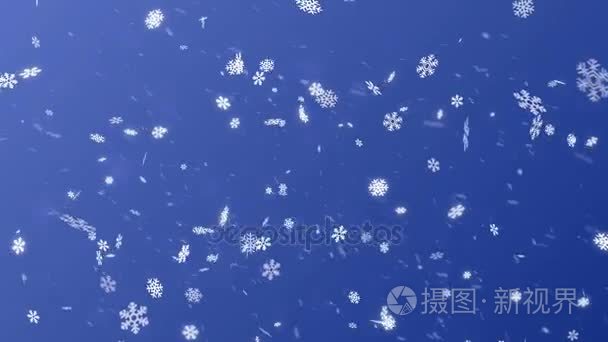 蓝色背景下飘落的雪花视频