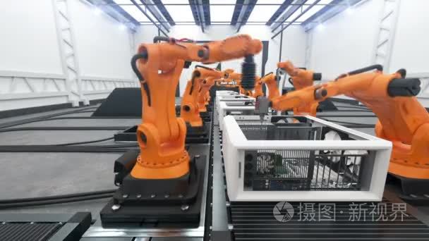 Robotic Arms Assembling Computers On Conveyor Belt. Modern Advan