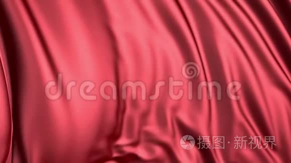 红色丝绸在缓慢的运动。 织物在风中发展得很顺利