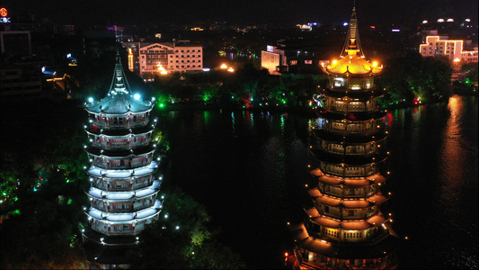 4k高清航拍桂林旅游著名景点日月双塔古建筑夜景视频