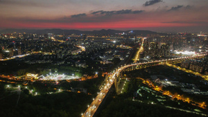 8K航拍南京江北新区晚霞延时桥北弘阳夜景车流延时7秒视频