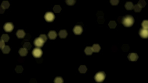 黑色背景上闪亮的无焦点黄球hd20x108012秒视频