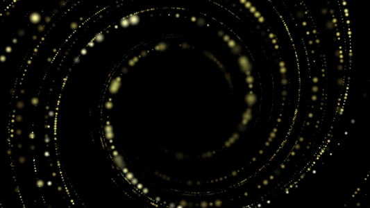 黑色背景空间中黄色圆形粒子的缓慢环形运动视频