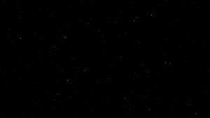 黑底小恒星形式的空间中白粒子的慢动以黑色背景为小型16秒视频