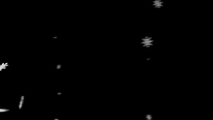 黑色背景的纹理雪花快速飞翔7秒视频