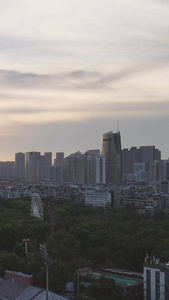 航拍城市风光落日晚霞夕阳天空城市体育场素材写字楼视频