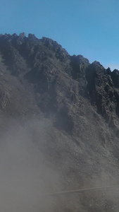 航拍云雾缭绕的高海拔山脉折多山视频大自然视频
