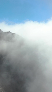 航拍云雾缭绕的高海拔山脉折多山视频自然风光视频