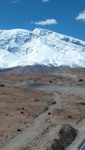 航拍新疆南部昆仑喀喇公路与雪山自然风光视频旅游目的地视频