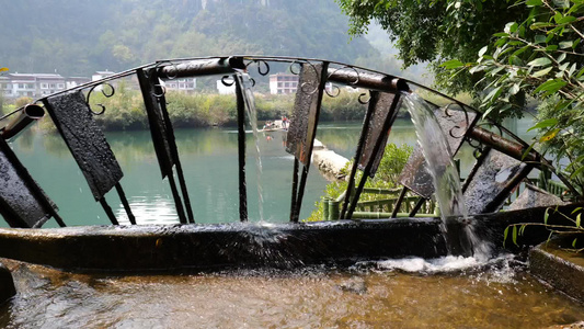 农田灌溉水车水筒车视频