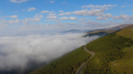 航拍山脉盘山公路与云海视频视频