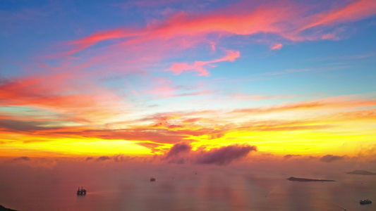 海南三亚三亚湾海洋天空日落夕阳晚霞火烧云航拍风景视频