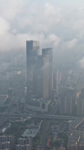南京城市建筑群CBD清晨薄雾航拍视频